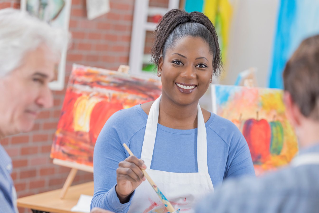 Friends paint together at a painting party